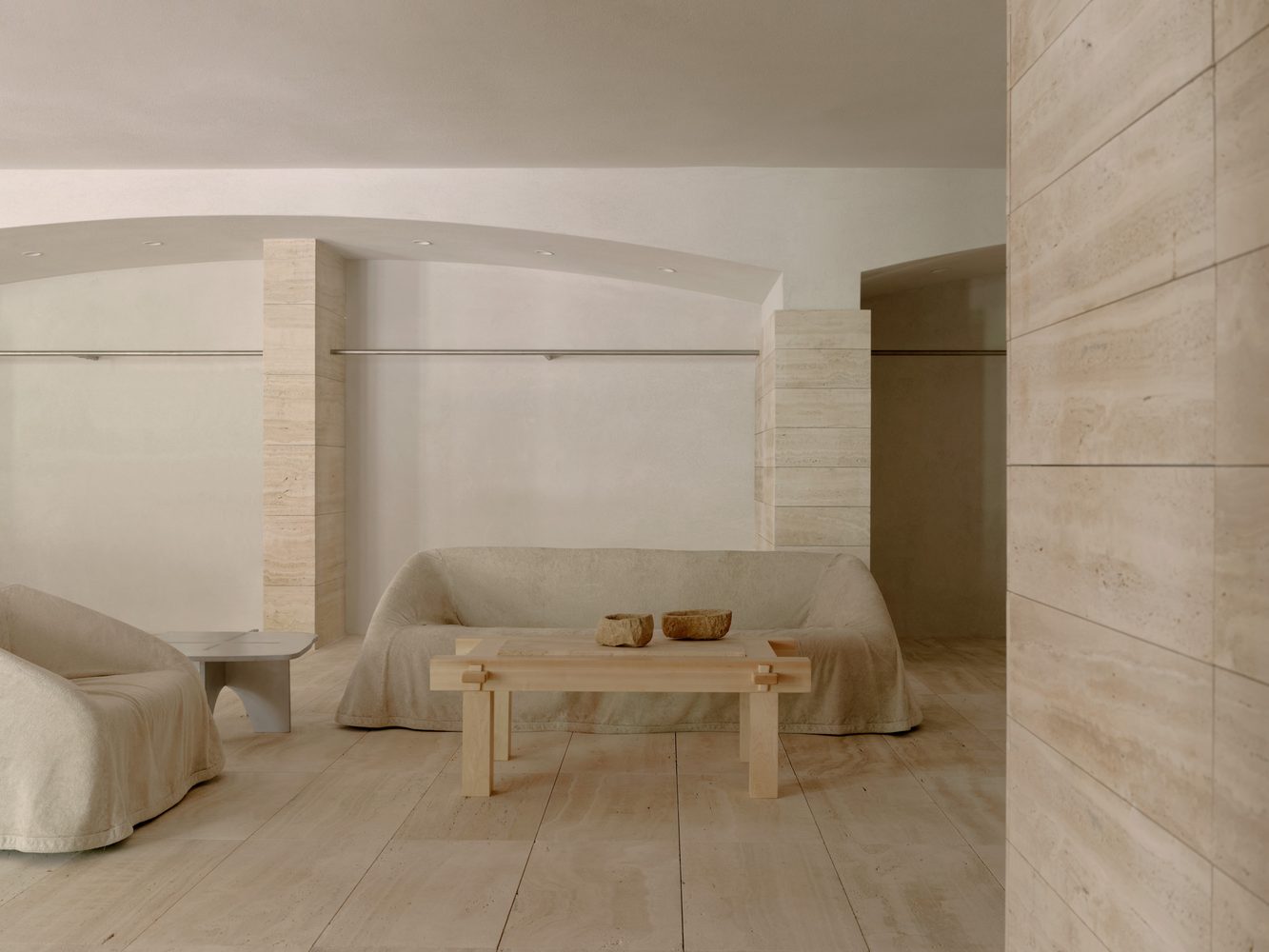 Living room with a draped sofa and timber coffee table